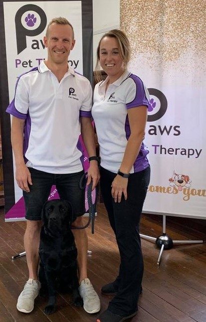 Matt, Sarah and Baxter, a PAWS volunteer team